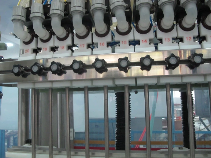 drip-free volumetric filling nozzles for high-value cosmetic hair oil